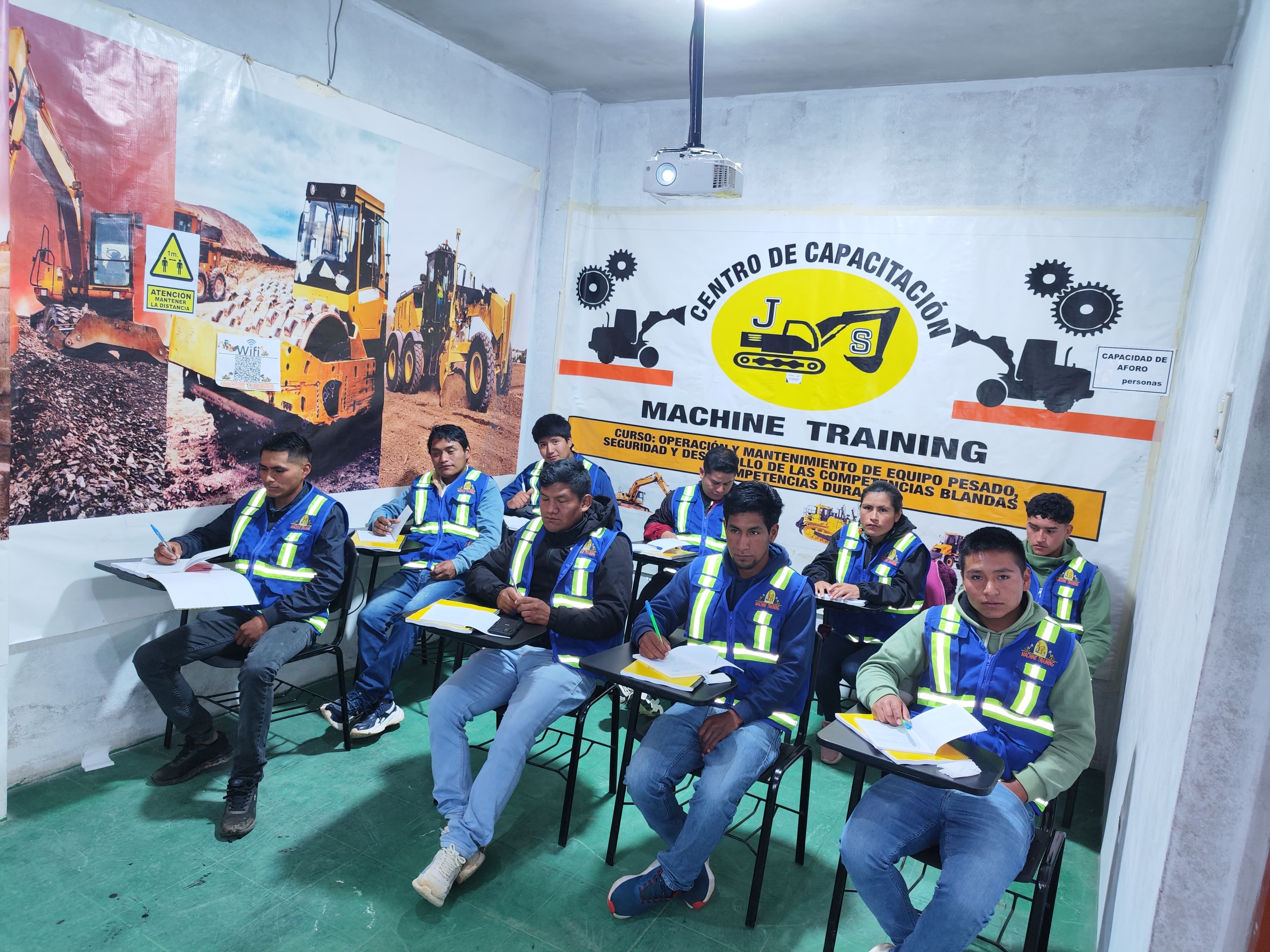 Participantes en simulador de grúa